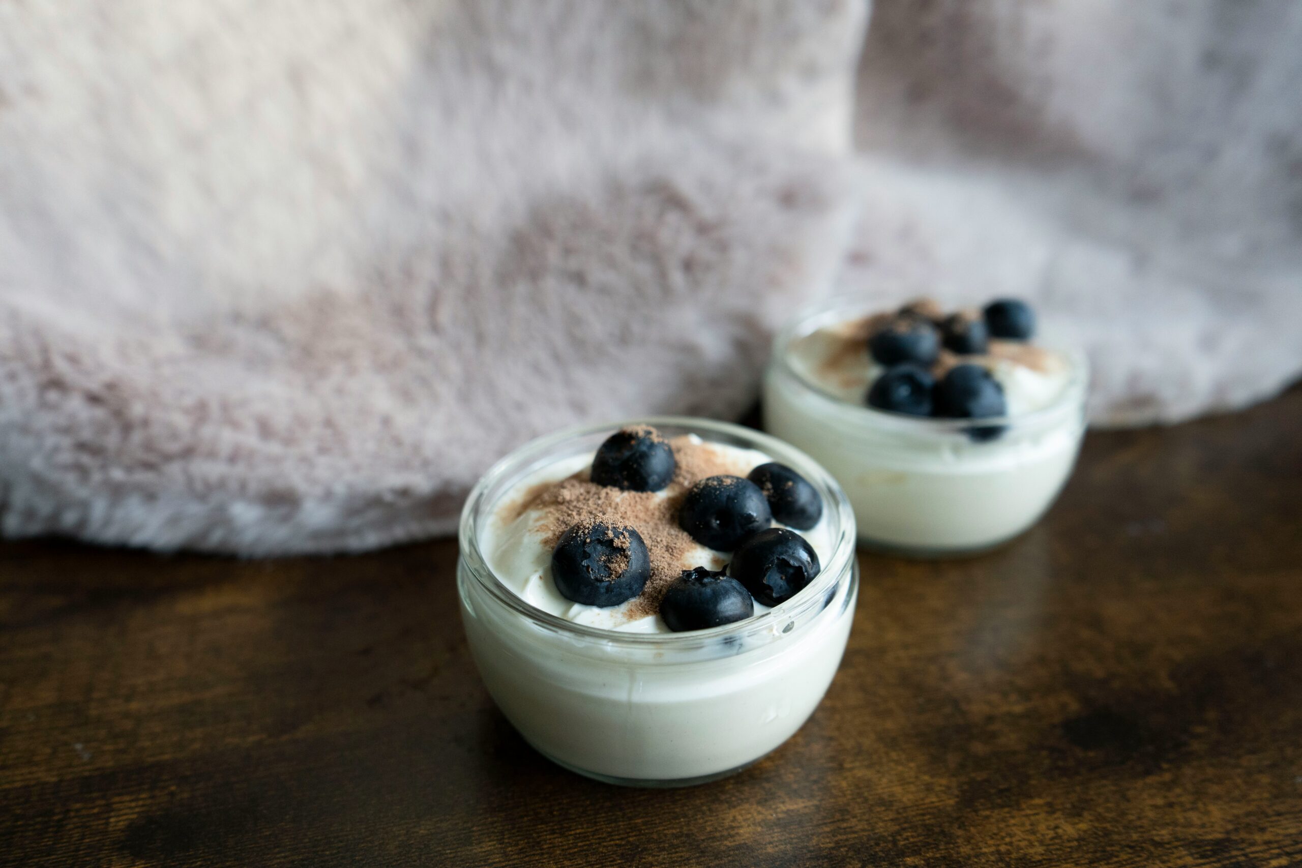 a couple of small bowls of food on a table